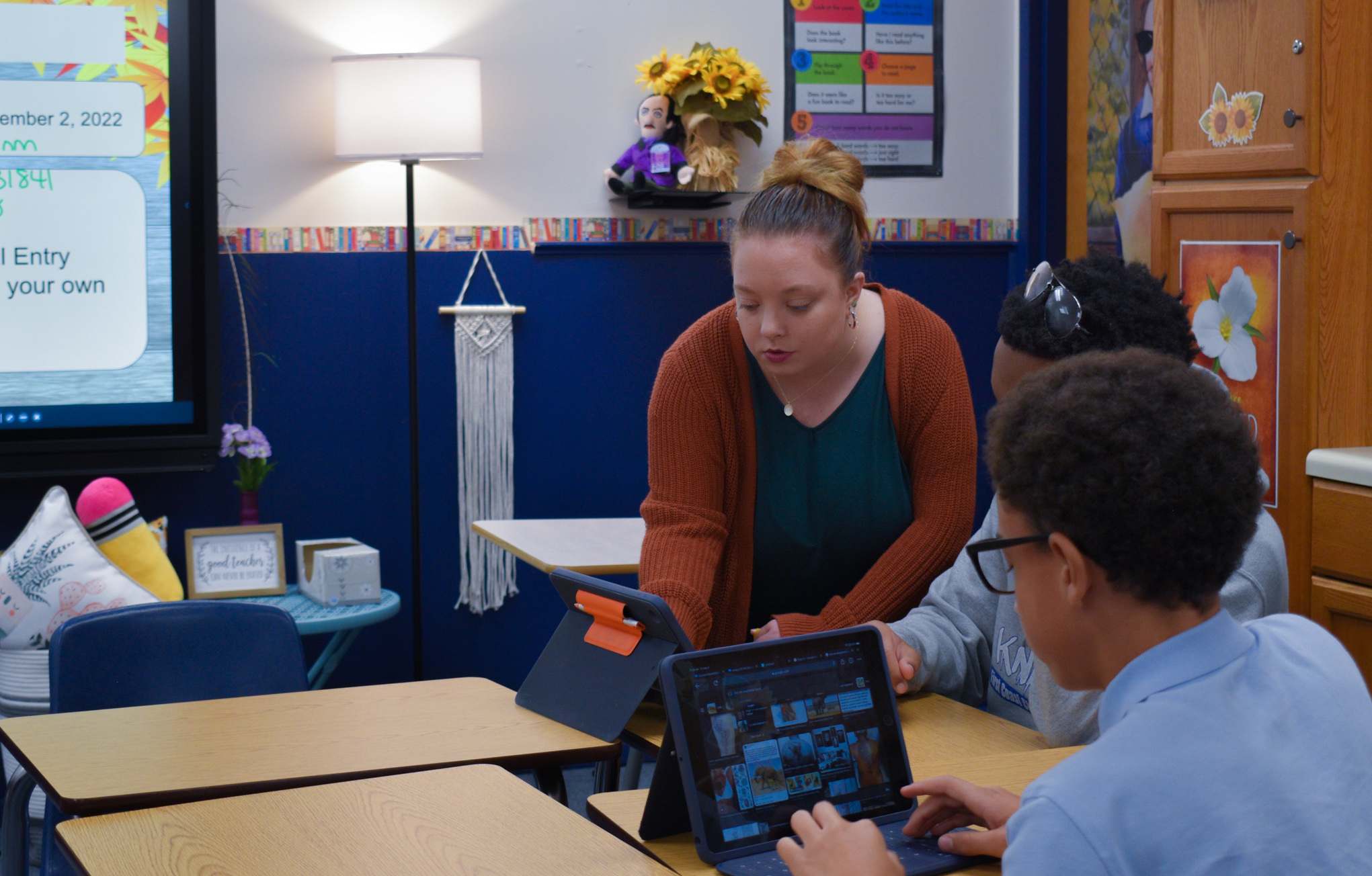 teacher helping student