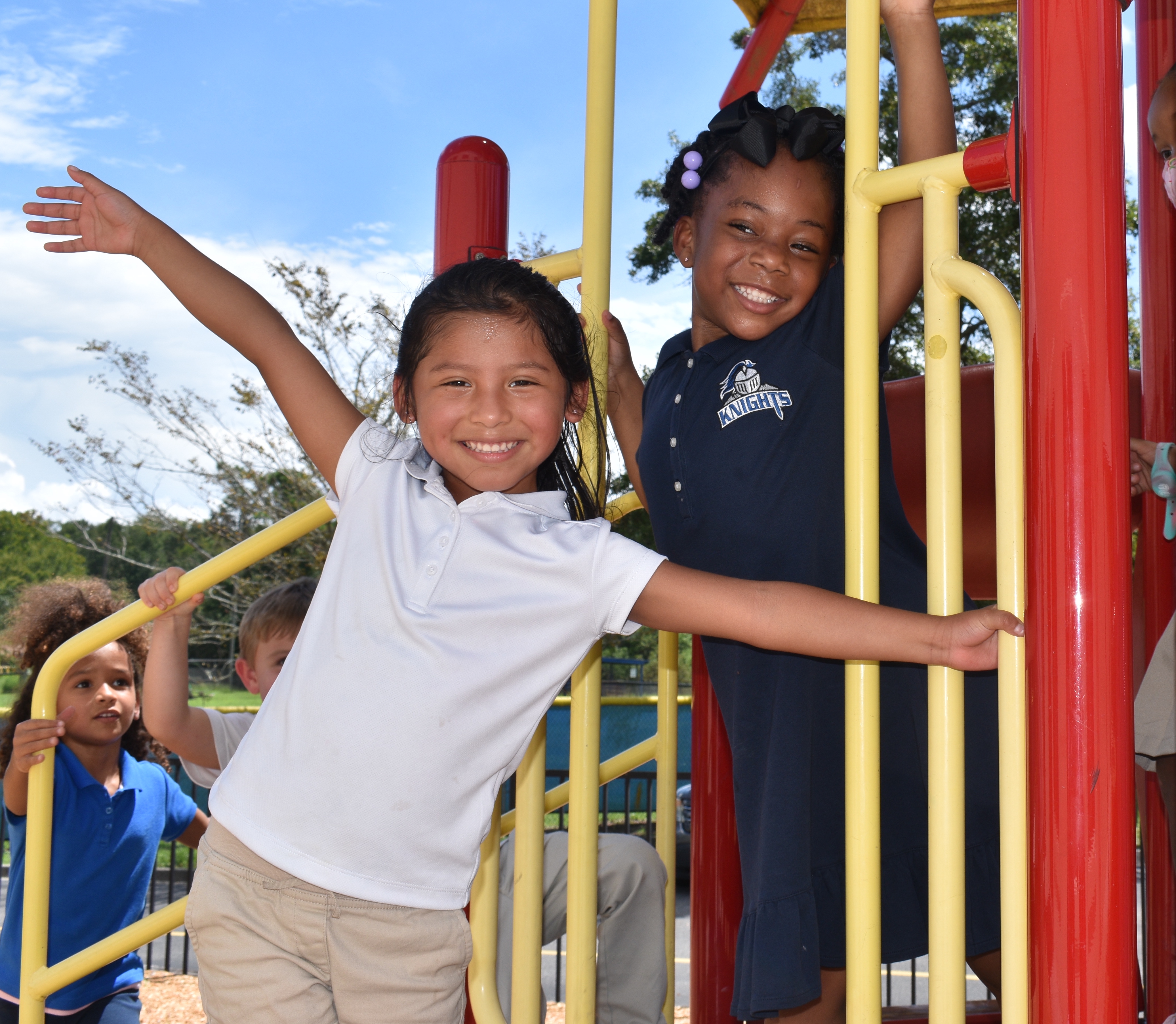 two girls playing on playground
