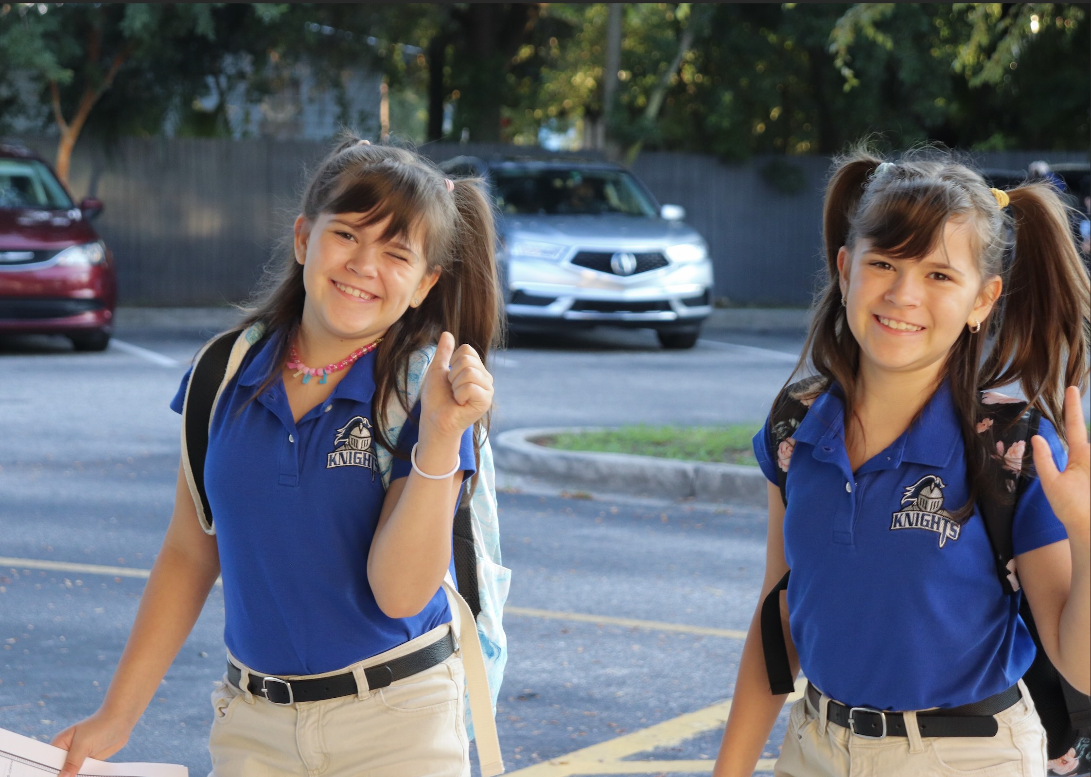 four elementary students smiling